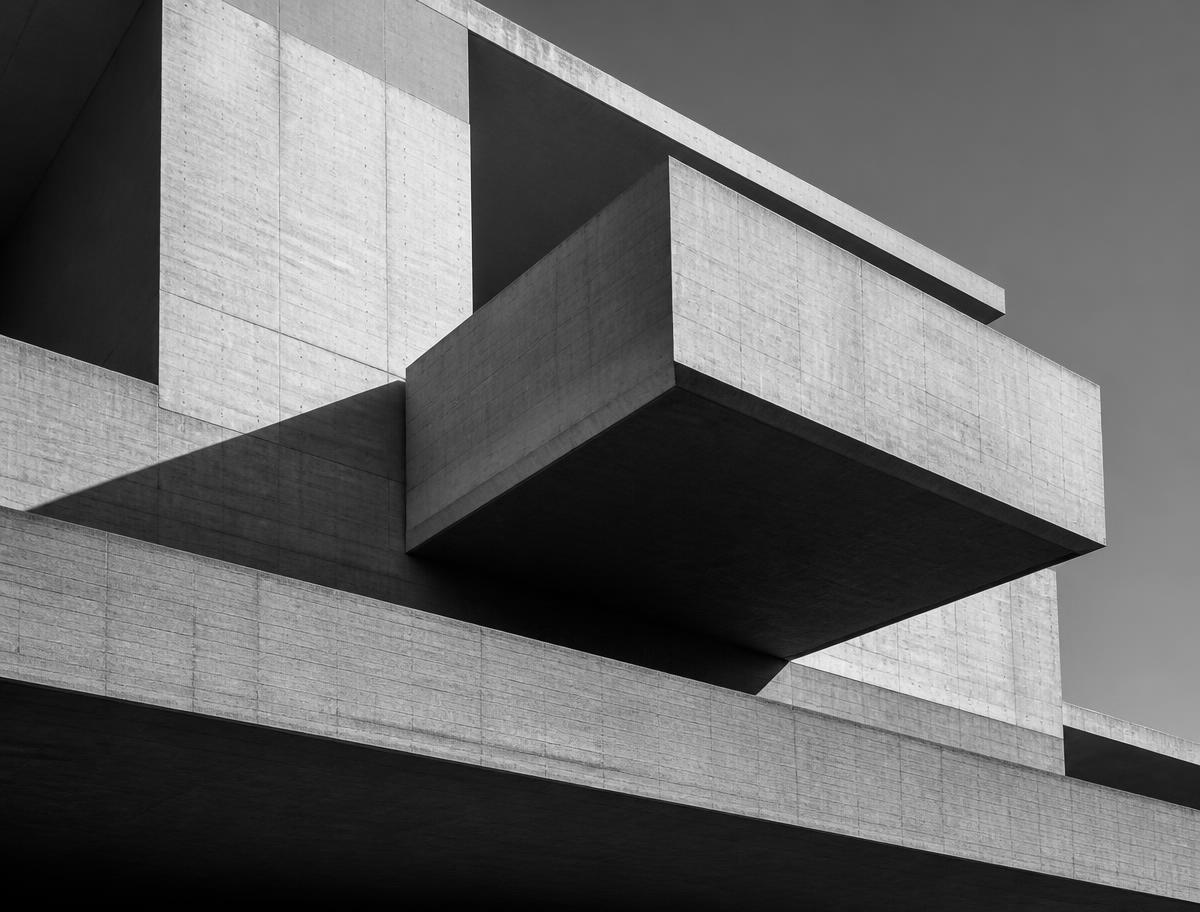 Black and white photograph of cantilevered concrete volumes